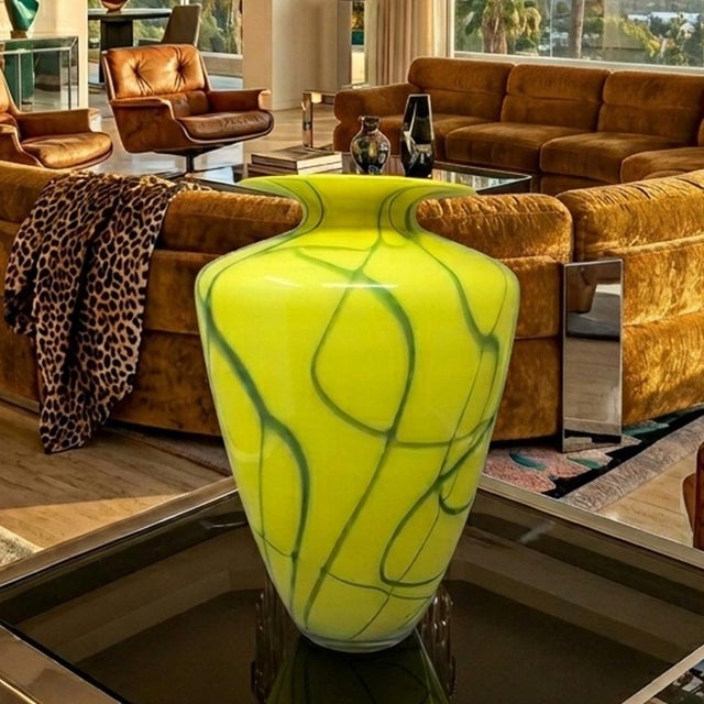 1960s a luxury example of mid-century venetian glassmaking this monumental vase by dogi embodies the vibrant spirit of...