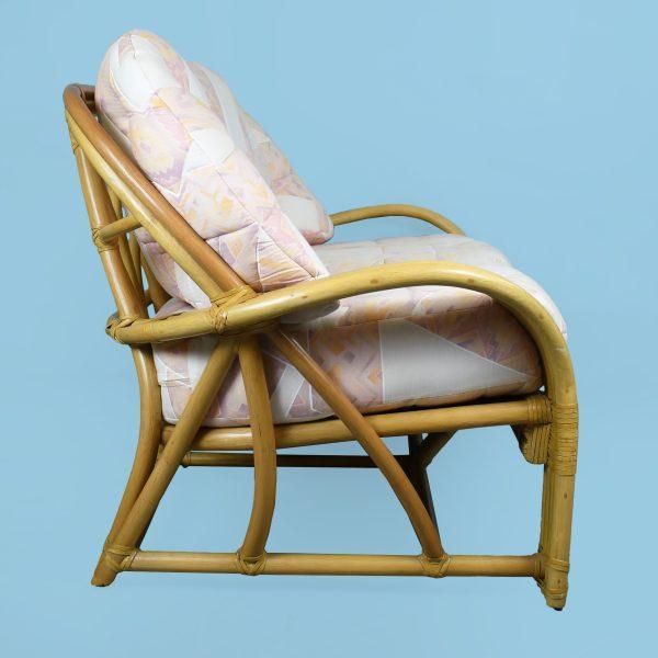 A vintage rattan loveseat by McGuire, the California maker's hand-worked rattan frame built for two. The open, airy...