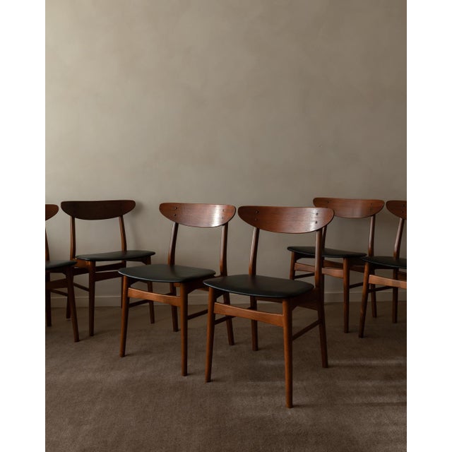 A calm, beautifully balanced set of six Danish mid-century dining chairs, stamped Made in Denmark. The design is all about...