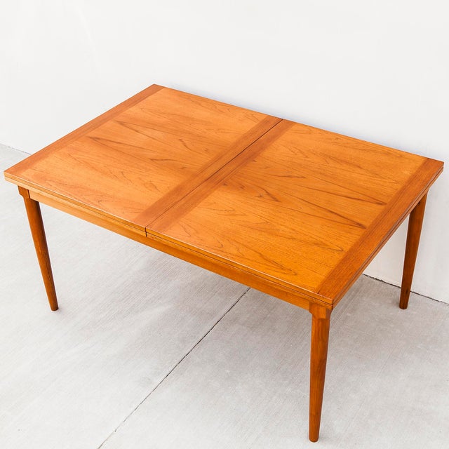 Refinished Skovmand & Andersen Danish flip top teak dining table c. 1970s. Lovely color and grain segmentation, square-to-...