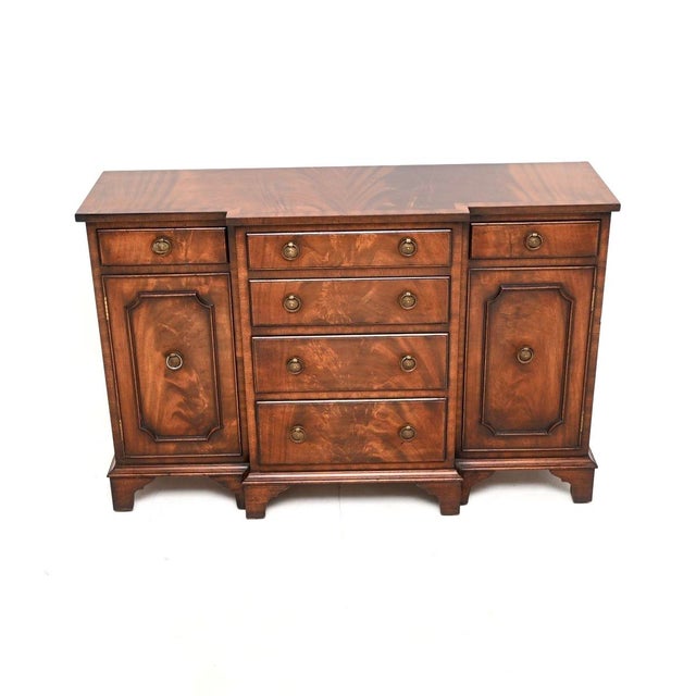 A compact and beautifully made antique Georgian style small breakfront sideboard. This was made in England, it dates from...