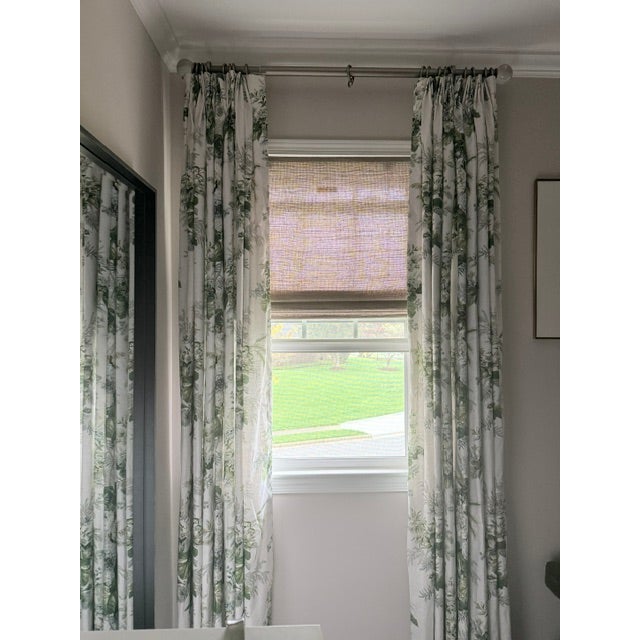 Custom drapery panels featuring Cowtan & Tout fabric, tailored with a classic two-finger pinch pleat for a clean,...
