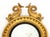 Rococo Style Giltwood Framed Convex Mirror, with circular mirror, the frame with two porpoise crests, scrollwork, and...