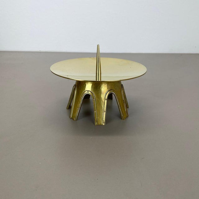 Article: Brutalist candleholder Origin: Austria Material: Brass Decade: 1950s This original vintage candleholder, was...