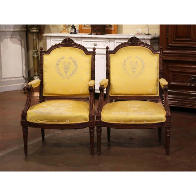 Elevate a formal interior with this striking pair of antique French Louis XVI style armchairs, crafted circa 1880 and...