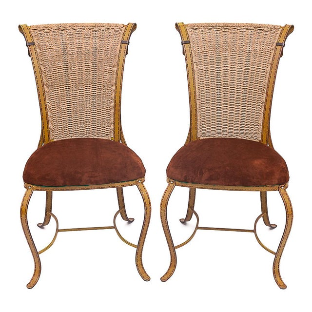 Four chairs by Jacques Adnet for Hermès. Series: "Sellerie" Copper alloy frame. Cane backrest. High-quality suede seat....