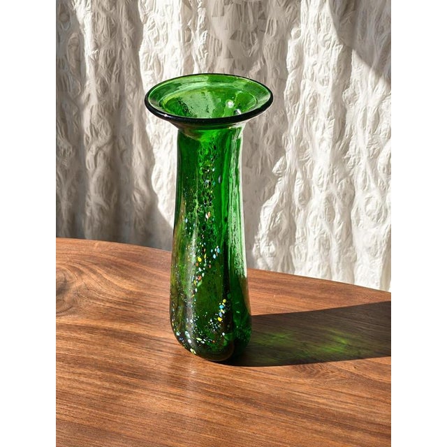 A distinctive free-form art glass vase by Hungarian glass artist Gyula Budveszel, dating from the 1990s. The vase is...