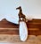 A charming set of six vintage hand-carved wood napkin rings, each featuring an elongated giraffe form with carved and...