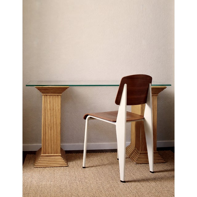 A beautiful pair of vintage bamboo and rattan column pedestals, Italy or France, circa 1960s/1970s. The pair features an...