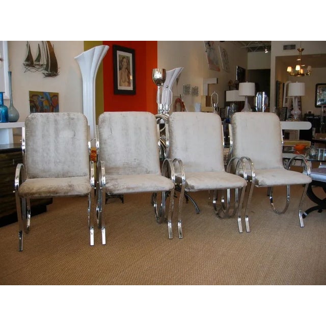 Wonderful set of four undulating Italian chrome framed chairs with moca colored crushed velvet upholstery. Newly polished...