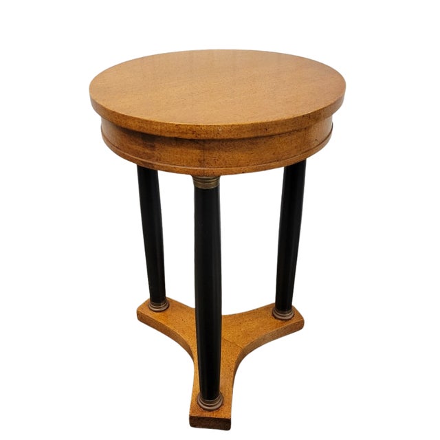 Vintage Empire Revival drink table featuring a faux bird's-eye maple veneer, three ebonized column supports and a...