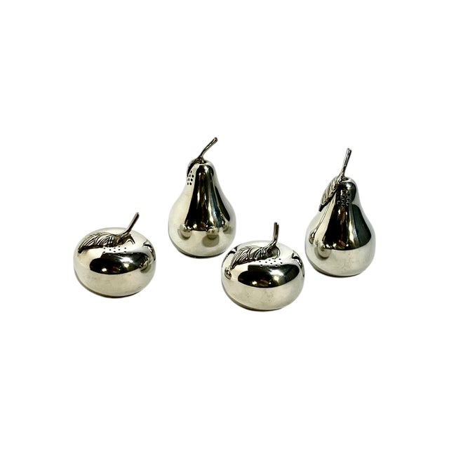 A delightful set of four Kirk Stieff pewter salt and pepper shakers, crafted in charming fruit forms including pears and...