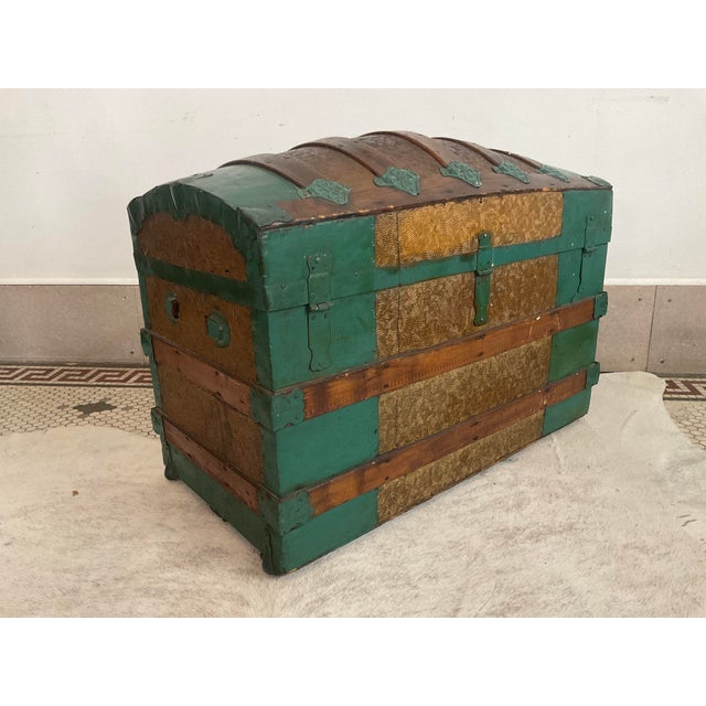Bring a striking piece of history into your home with this stunning antique dome-top steamer trunk (also known as a...