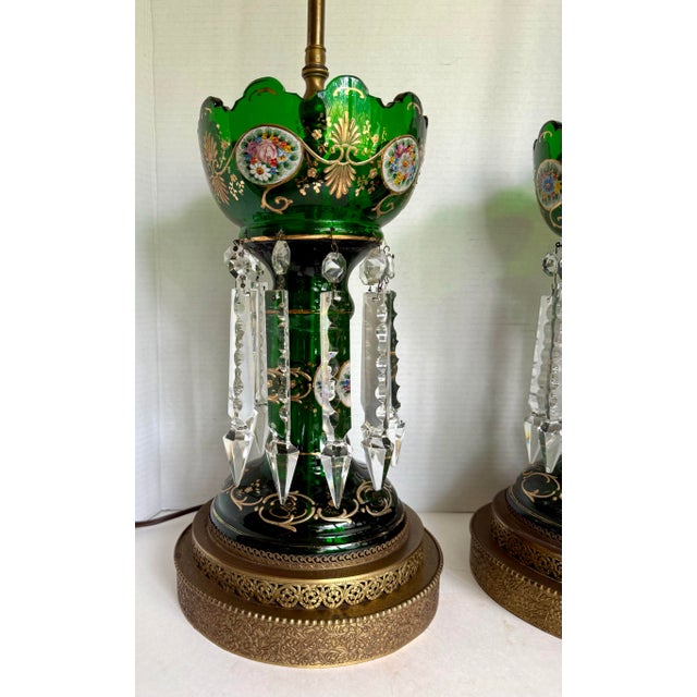 Here is a spectacular pair of late 19th-century emerald-green glass lusters, thoughtfully converted into dramatic table...