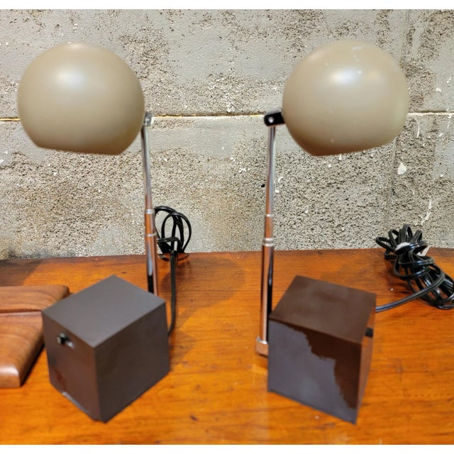 A pair of Lightolier "Lytegem" articulating task lamps attributed to Michael lax. Telescoping can extends from 7 inches...