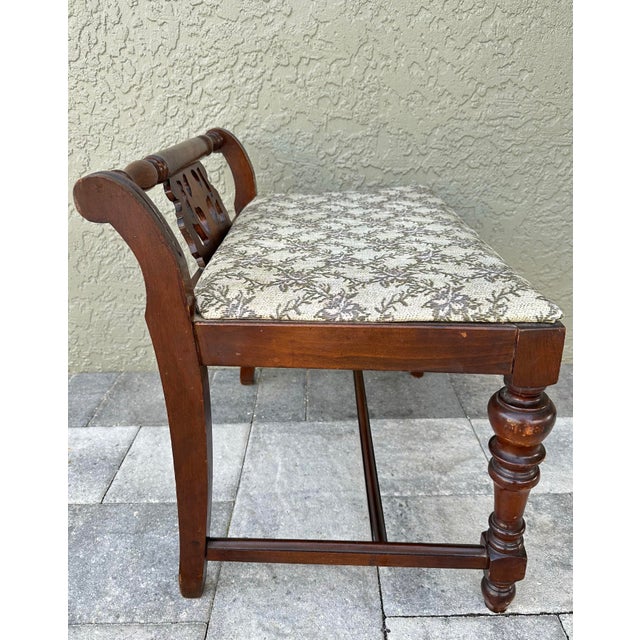 Dark mahogany wood vanity/boudoir bench. 26” wide x 16” deep x 22” tall, seat height is 16 1/2”. Seat has been recovered...