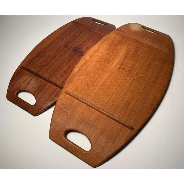 Vintage Jens Quistgaard pair of gondola trays for Dansk Slight variation in stain. Both signed. Different branded year marks.