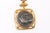 A Dove & Chimaera AR quarter "stater" [coin] pendant trimmed with 22 karat gold. This AR quarter stater was minted in...