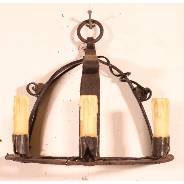 Exquisite pair of wrought iron wall sconces crafted with period elements. Superb work with great character. The sconces...