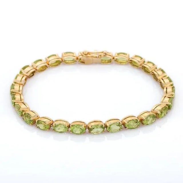 This is part of Chairish’s Fine Jewelry assortment. This Peridot Tennis Bracelet in 18K gold showcases 26 endlessly...