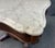 This 19th century flamed mahogany center table is topped with a beautifully contoured white marble slab that highlights...