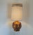 This amazing lamp is from the 70s. Its made with ceramic and the surface has a thick gold leaf finish. The original lamp...