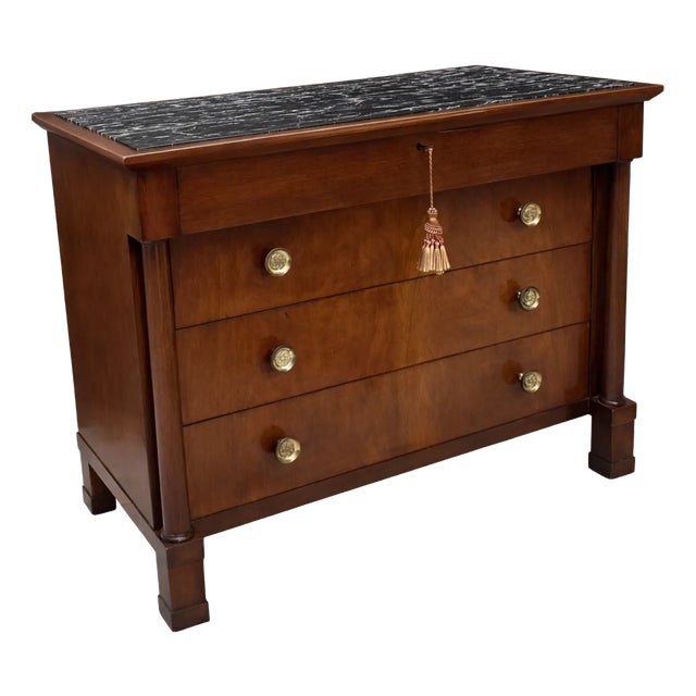 Early 20th Century John Stuart French Empire-Style Walnut Commode With a Black Marble Top. For Sale