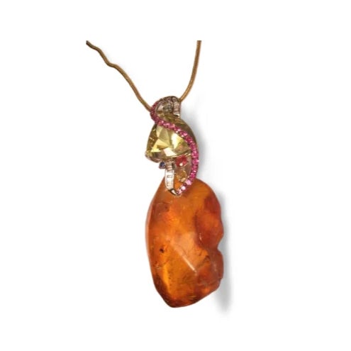 This pendant necklace is crafted in 14K gold and features an oversized natural amber , triangle cut lemon quartz , citrine...