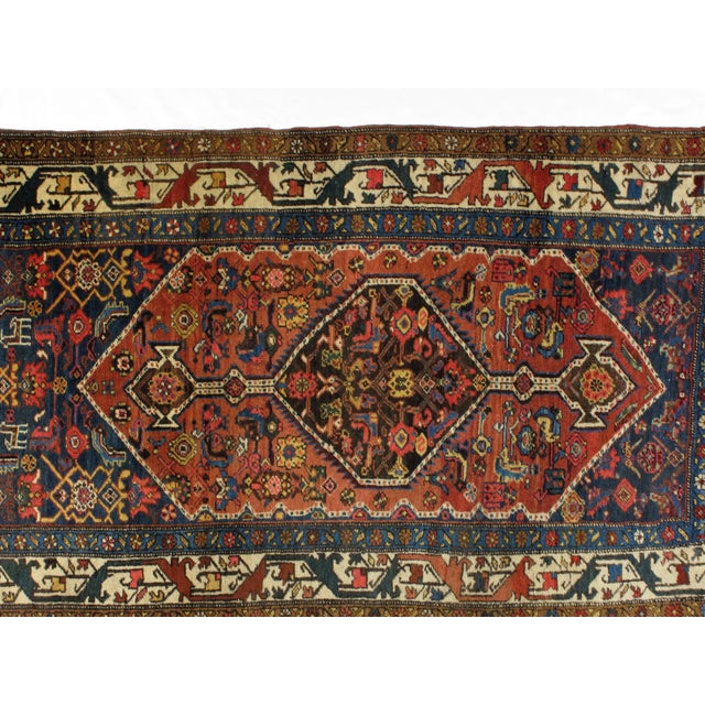 This master piece is a wool on wool pile genuine hand woven antique Persian Halvayi Bijar in excellent condition.