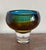 A mid-century modernist studio glass vase from Kosta Sweden. In jewel tones of amber and sapphire, suggesting waves and...