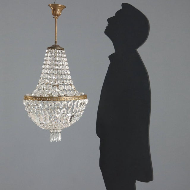 Hot air balloon chandelier. One central light, leaf-shaped metalwork, clear glass necklaces and pendants. Italy, late 19th...