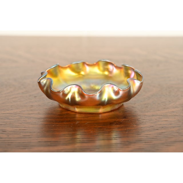 A gorgeous Arts & Crafts or Art Nouveau period Favrile iridescent art glass scalloped bowl By Louis Comfort Tiffany for...