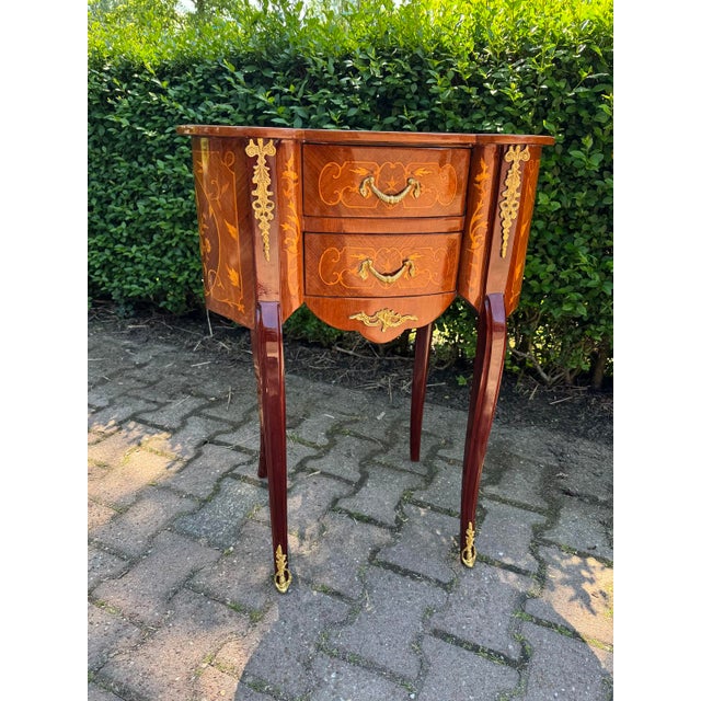 A refined pair of vintage French Louis XVI-style commodes, dating from around 1980 and beautifully crafted from mahogany...