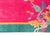 An early 20th century Chinese Art Deco rug with a fuchsia field surrounded by a thin gold and wide turquoise border, and...