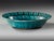 Underglaze-painted dish with two birds on a blossoming branch A pottery dish rising from a short vertical foot through a...