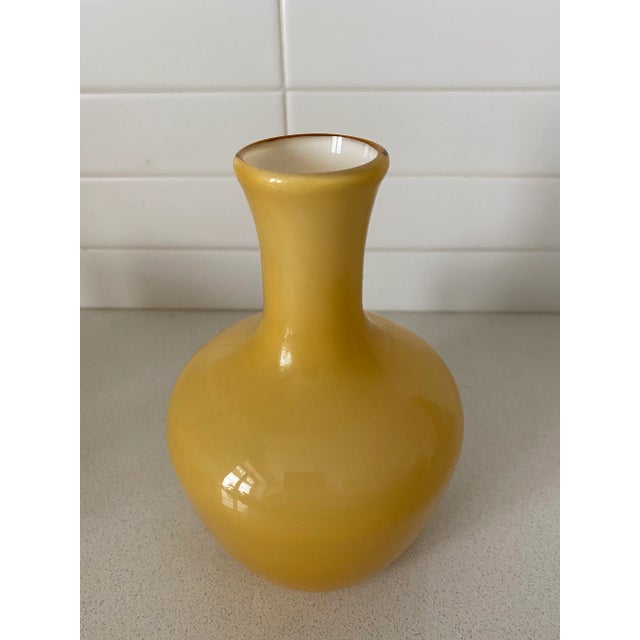 Two matching hand-blown amber cased glass glasses and vase. These could be used as a bathroom set, or guest bedroom...