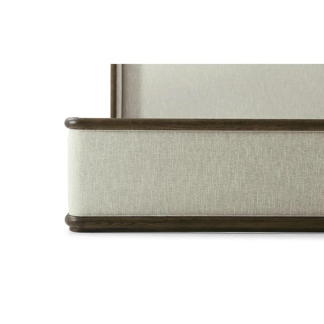 Modern Framed and Upholstered Bed, with a smooth straight grain exposed oak frame trim in our dark earth finish. With a...