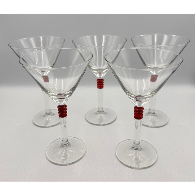 Elevate your cocktail hour with this exquisite set of five vintage martini glasses! Each glass features the iconic...