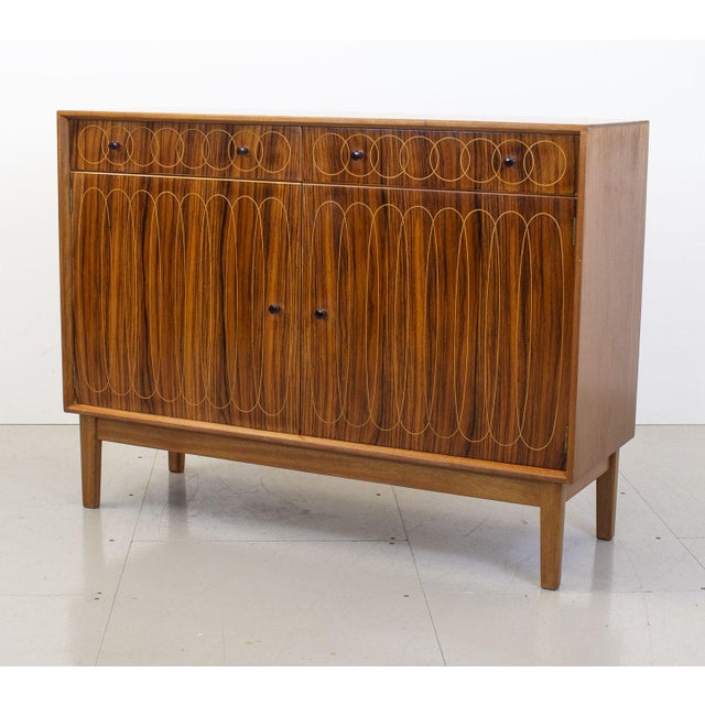Known as the Ellipses sideboard due to its striking pattern of overlapping circles and ellipses, this piece was made by...