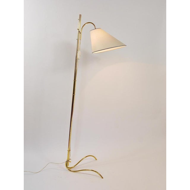 A delicate and elegant mid-century floor lamp from the 1950s, designed and executed by rupert nikoll in vienna, austria....