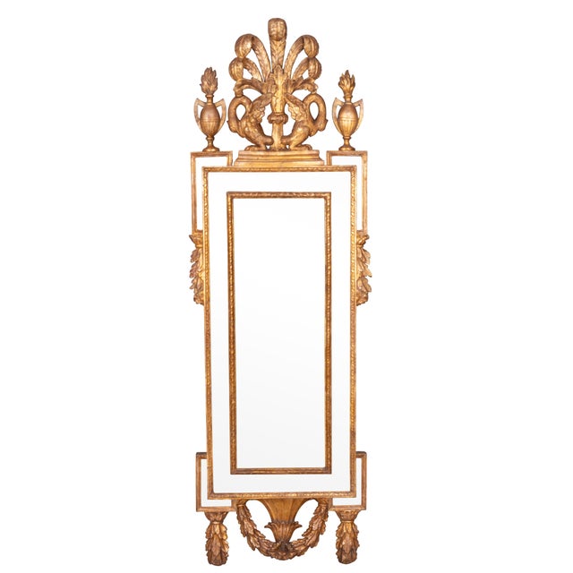 Each crest with ostrich plume and pair of exotic birds flanked by two handled urns over a mirror plate with outer mirror...