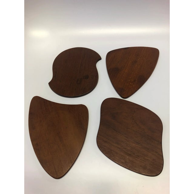 A set of 8 Danish teak appetizer plates.