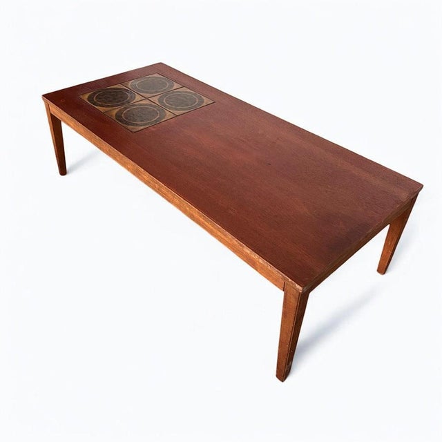 This teak coffee table blends mid century coffee table style with durable teak wood construction to create a stunning and...