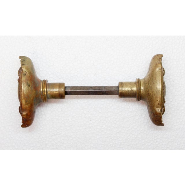 These Rococo style oval door knobs were made by Corbin in the 1905 catalog. It is part of the N-10600 St. Denis group....