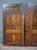 Pair of solid walnut and burr walnut veneer doors. featuring an elegant symmetrical design with particularly decorative...