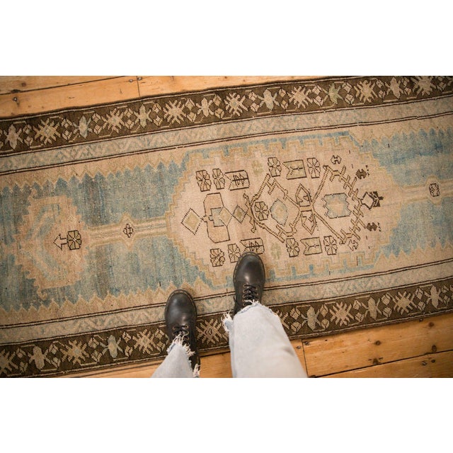 :: Oversize lozenge asymmetric interior filled main medallion with elongated, partially interconnected double finial minor...