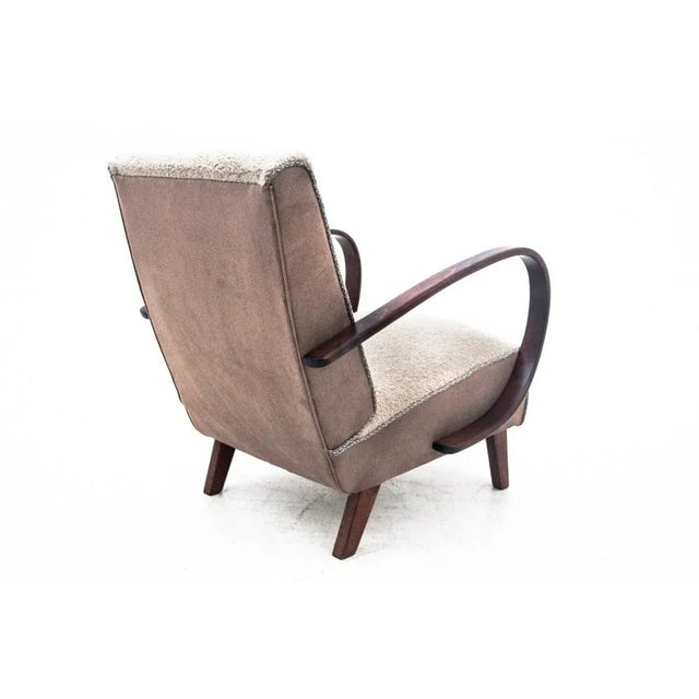 Iconic armchairs designed by J. Halabala in the Art Deco style, made around 1930. Seats and backrests upholstered with a...