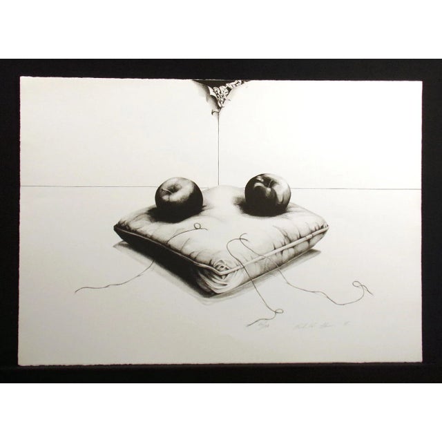 Unframed vintage lithograph art print on paper of a black and white realistic still life of two apples resting on a pillow...