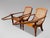 A Handsome Matched Pair of Original Anglo-Indian Teak and Cane Plantation Chairs, circa 1910–1920. Crafted in solid teak...