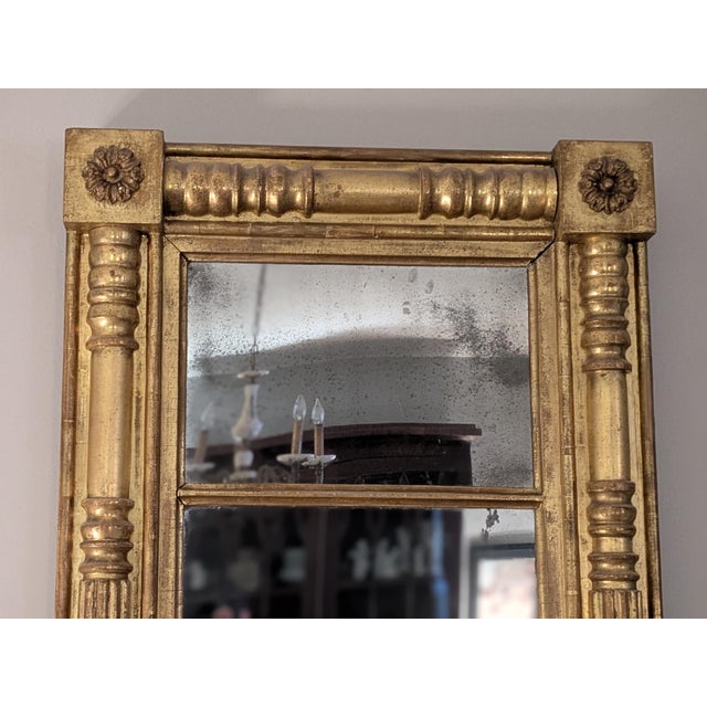 A large and elegant Federal Wall Mirror dating from c.1840. The two-section Mirror is framed by sections of beautifully...